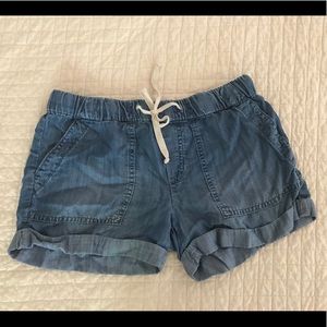Chelsea and Violet pull on shorts